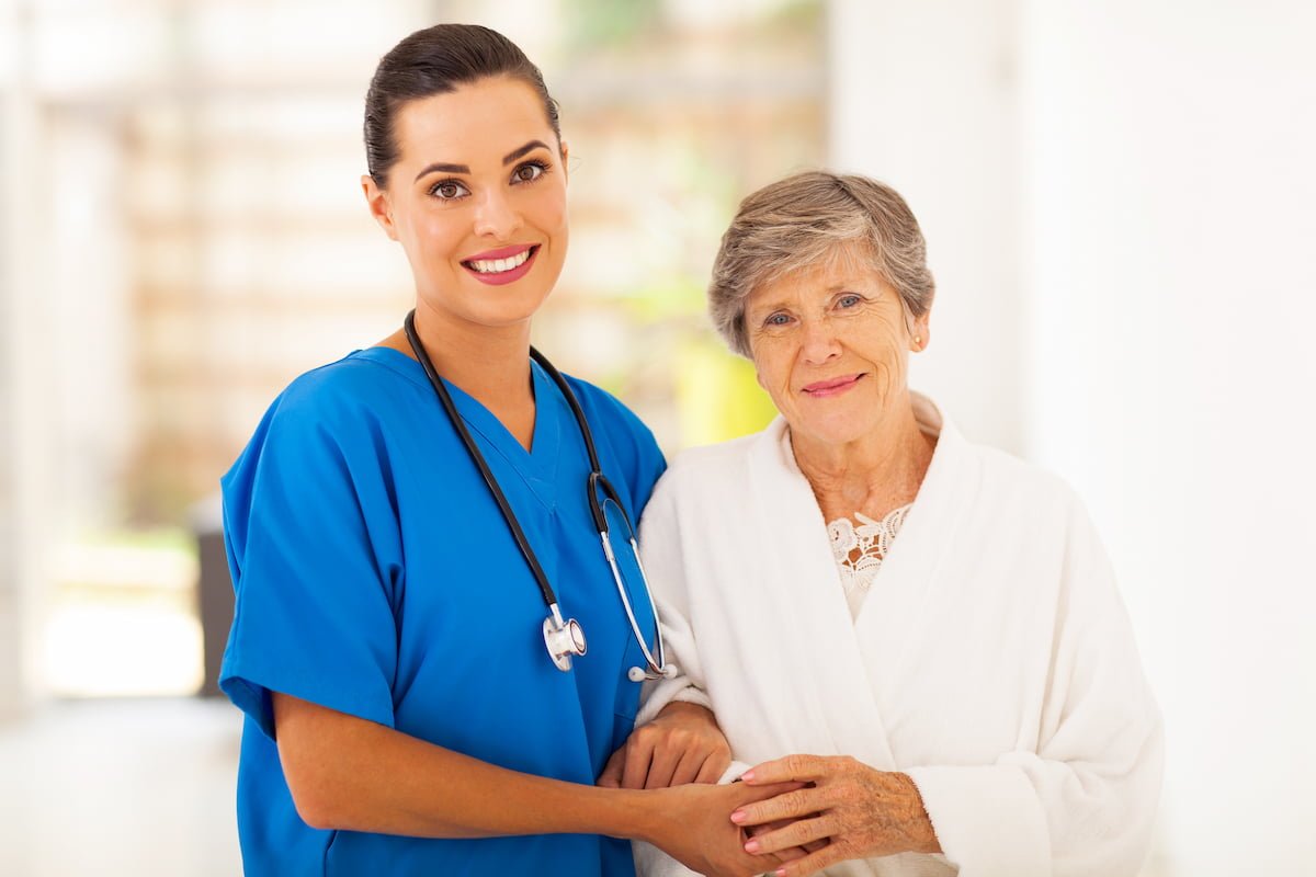 young nurse caregiver with an elderly woman