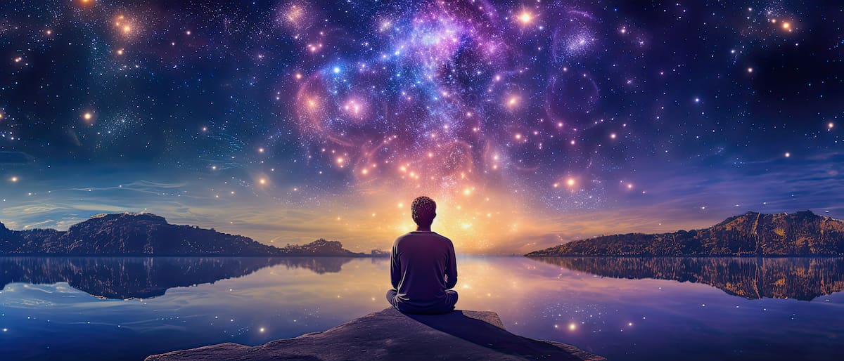 Man meditating looking at stars in the sky