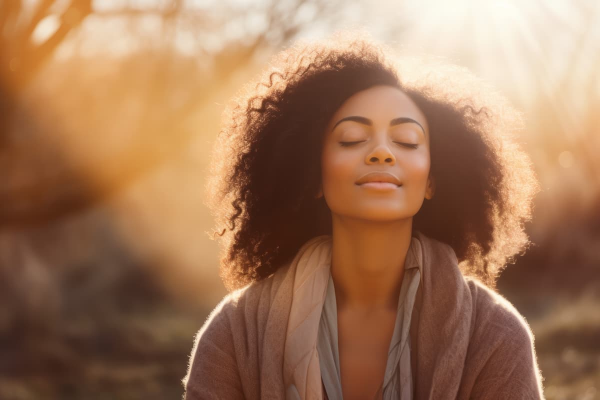 woman enjoying sunshine outdoors